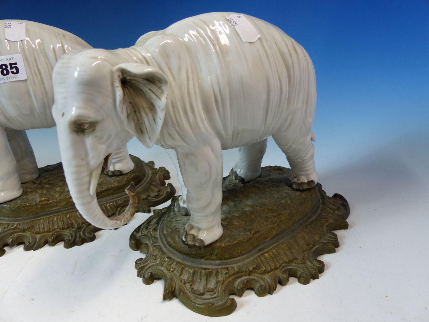 A PAIR OF ANTIQUE GERMAN PORCELAIN ELEPHANTS STANDING ON LATER ORMOLU BASES. W 26cms. - Image 3 of 8