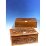 TWO CHINESE HARDWOOD BOXES, BOTH RECTANGULAR LIDS CARVED CENTRALLY WITH A VIGNETTE OF FIGURES