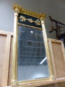 AN EARLY 19th C. RECTANGULAR MIRROR, THE GILT BEADED CRESTING OVER AN EBONISED PANEL WITH CENTRAL