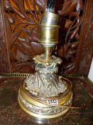 THREE SILVERED BRASS TABLE LAMPS CAST WITH FOLIAGE BELOW NOZZLES RAISED ON SOCLES, THE CIRCULAR FEET