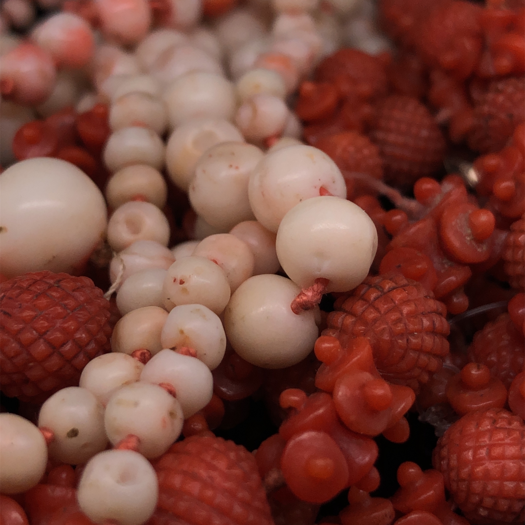 AN ANTIQUE CARVED RED CORAL ROPE OF BEADS AND SPACERS, COMPLETE WITH AN ENGRAVED BOX CLASP. APPROX - Image 6 of 31