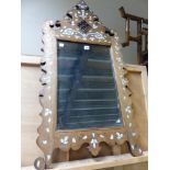 A BEVELLED GLASS RECTANGULAR MIRROR WITHIN A CUT WORK FRAME INLAID WITH MOTHER OF PEARL PETALS AND