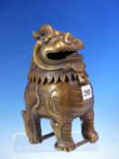 A CHINESE BRONZE INCENSE BURNER IN THE FORM OF A BUDDHIST LION, FOUR CHARACTER MARK ON ITS BELLY.