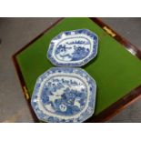 TWO 18th C. CHINESE BLUE AND WHITE CANTED RECTANGULAR PLATTERS CENTRALLY PAINTED WITH ISLAND SCENES.
