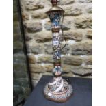 AN EGYPTIAN CHAMPLEVE ENAMELLED COLUMNAR TABLE LAMP WITH FOUR BANDS OF INSCRIPTION SPIRALLY UP