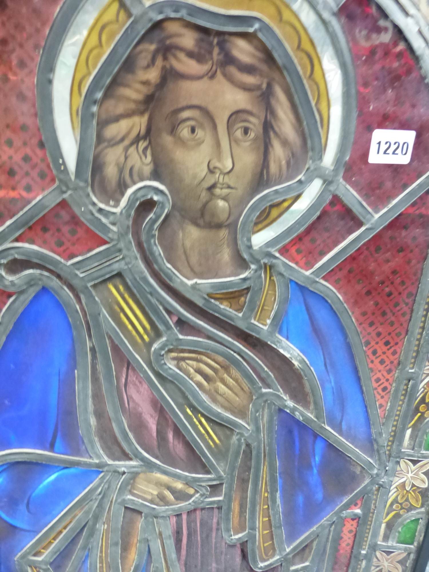 A VICTORIAN STAINED GLASS PANEL OF A SAINT STANDING IN A ROUND ARCHED NICHE, THE LEADED GLASS - Image 2 of 4