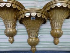 THREE GILT COMPOSITION WALL LIGHTS, EACH CAST WITH A DEMILUNE OF PALM LEAVES TAPERING TO A