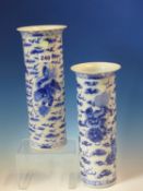 A PAIR OF CHINESE BLUE AND WHITE SLEEVE VASES PAINTED WITH BUDDHIST LIONS AMONGST CLOUDS BELOW THE