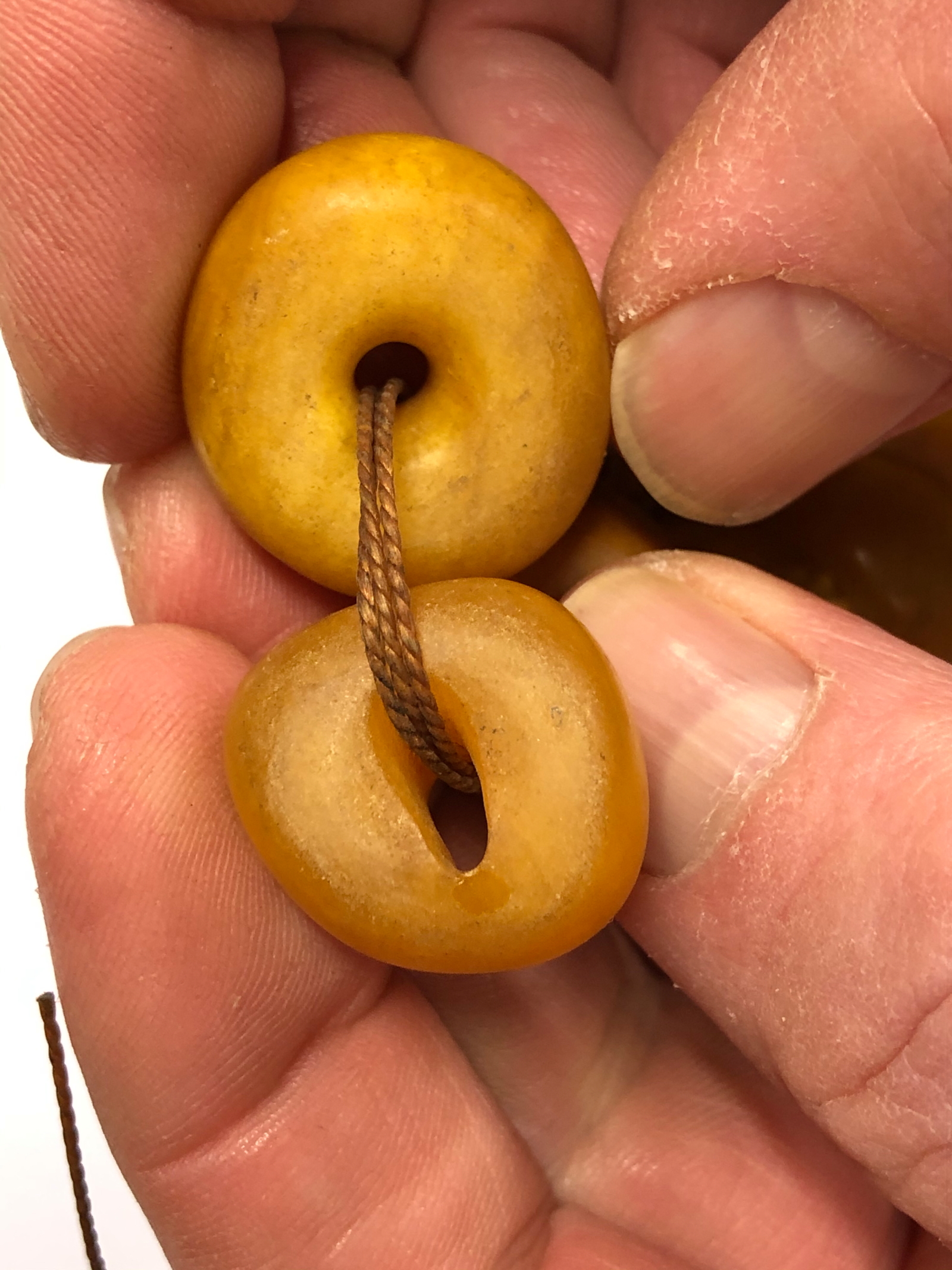 A CONTINUOUS STRING OF IRREGULAR GRADUATED ETHIOPIAN AMBER BEADS, PROBABLY FIRST HALF OF THE 20th C. - Image 6 of 8