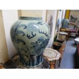A PAIR OF MING STYLE BLUE AND WHITE BALUSTER JARS, EACH PAINTED WITH TWO QILIN BY PLANTAINS. H