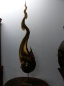 A PARCEL GILT IRON FLAME AND SMOKE SHAPED SCULPTURE RAISED ON A POLE FROM A SQUARE FOOT. H 172cms.