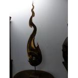 A PARCEL GILT IRON FLAME AND SMOKE SHAPED SCULPTURE RAISED ON A POLE FROM A SQUARE FOOT. H 172cms.