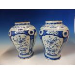 A PAIR OF 18th C. DUTCH DELFT BLUE AND WHITE OVOID JARS, EACH PAINTED WITH FOUR PANELS OF FLOWERS