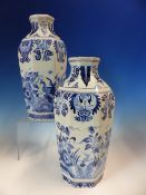 A PAIR OF DELFT BLUE AND WHITE OCTAGONAL VASES PAINTED WITH PEACOCKS AMONGST FLOWERS, JV MARKS. H