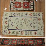 Three Kilim rugs, assorted sizes, one measures 9' 6" x 2' 5". Provenance: From a Hampton, New York