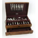 International sterling flatware set, "Prelude" pattern, approximately 62 troy oz TW. Provenance: