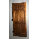 Custom raised panel door with native wood and painted on other side, 84" H x 34" W x 1 3/4" D.