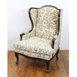 Wing back chair with crewel work fabric, 42" H x 31" W x 31" D. Provenance: From a Manchester,