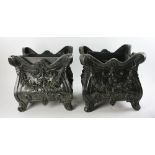 Two Victorian-style black painted metal planters, 13" H x 12" W x 12" D. Provenance: From a