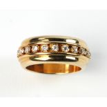14k gold and diamond band, approximately 7 grams TW, size 6 1/2. Provenance: From a Winchester,