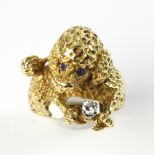 18k gold poodle ring, approximately 14 grams TW, size 7. Provenance: From a Winchester,