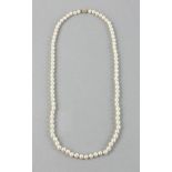 Pearl necklace with 14k yellow gold and diamond clasp, eighty-six (86) lustrous silvery white
