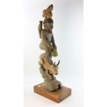 Antique carved Indian figure on stand, 38" H.