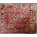 Antique Persian Sarouk rug, 13' 8" x 10' 4". Some fading, pile is good. Provenance: From a