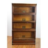 Antique oak four stack bookcase, approximately 60" H x 34" W x 10" D. Provenance: From a Newton,