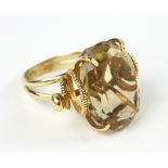 18k gold topaz ring, approximately 17 grams TW with stone, size 8 1/2. Provenance: From a