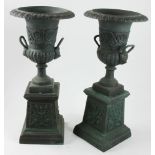 Pair of Victorian-style cast iron garden urns on pedestals, 42" H x 18" diameter.