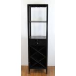 Designer black painted wood tall shelf, having single drawer, 69" H x 19" W x 15" D.