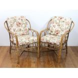 Two vintage rattan armchairs. Provenance: From a Delray Beach, Florida estate.