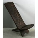 Folk art African carved chair, 38" H x 14" W. Provenance: From a Fitchburg, Massachusetts estate.