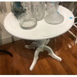 Painted white occasional table, 27" H x 30" diameter. Provenance: Studio Props of Martha Stewart.