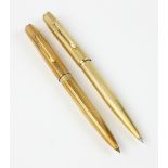 Two gold pens. Provenance: From a Coronado, California estate. PLEASE NOTE: payment for silver,