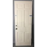 Painted white wood door, 80" H x 29 3/4" W. Provenance: Studio Props of Martha Stewart.