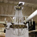 Neoclassical French-style bronze chandelier with crystal swag beads, 40" H x 30" W. Provenance: From