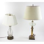 Two assorted cut crystal and brass lamps, in working condition, one 21" H and other is 28" H.