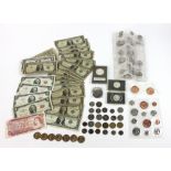 Silver certificate, one dollar and two dollar bills, with uncirculated coins. Provenance: From a