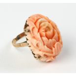 18k rose gold carved coral ring, approximately 11 grams TW with coral, size 7 1/2. Provenance:
