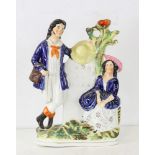Staffordshire figure, "Couple 30 Miles to London", 11" H. Provenance: From a Saugus, Massachusetts