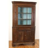 Early New England corner cupboard having 9 pane glass panel door, 80" H x 43" W x 29" D.