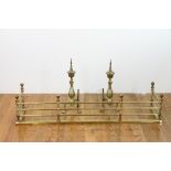 Colonial brass fire fender, 11" H x 51" L x 13" W, together with andirons. Provenance: From a