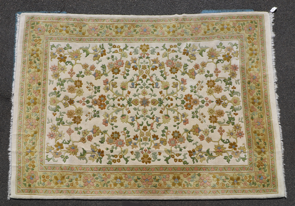 Indo Tabriz rug, labeled Cathay, 9' x 12'. Provenance: From a Manchester, Massachusetts estate.