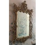 English George III-style giltwood mirror, 49" H x 27 1/2" W. Provenance: From a Manchester,