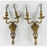 19th century French brass figure head wall sconces, 20" H x 10" W. Provenance: From an Everett,