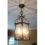 Colonial-style brass light fixture, 27" H x 10 1/2" W. Provenance: From a Manchester,