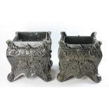 Two Victorian-style black painted metal planters, 13" H x 12" W x 12" D. Provenance: From a
