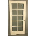 Painted white wood door, 88" H x 36 1/2" W. Provenance: Studio Props of Martha Stewart.